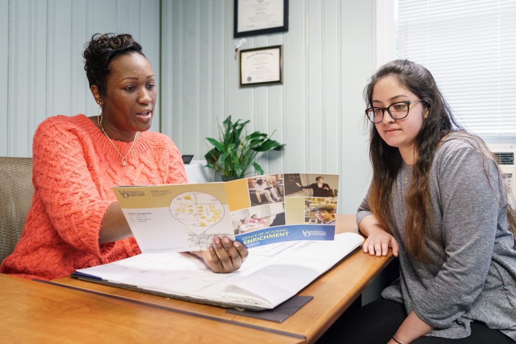 Student working with a mentor.